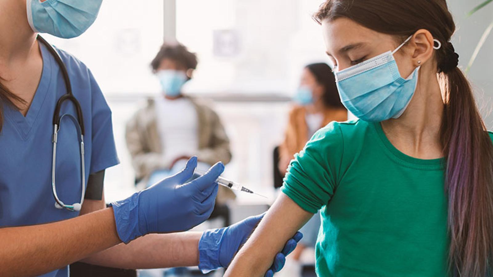 Young girl getting vaccinated