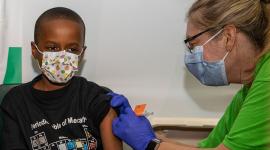 Boy getting COVID-19 vaccine