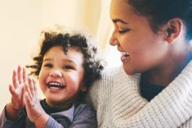 A mom holding an infant