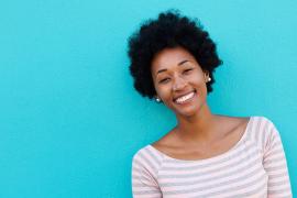 Cheerful woman against blue background
