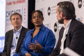 Three panelists talk during a prior year's Chicago Sports Summit.
