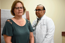 Cardiologist Gaurav Shah examines a patient