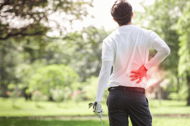 Golfer holding back