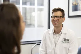 Dr. Grunvald talking with a patient