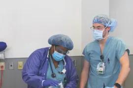 Two Rush nurses in scrubs