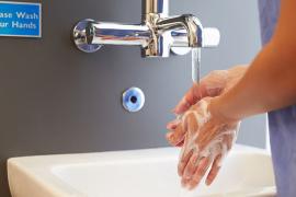 Health care provider washing hands