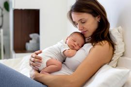 Baby and mom snuggling