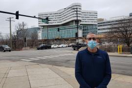 Eric stands in front of RUSH medical center.