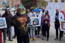Community leaders speak to the media about food insecurity on Chicago's West Side