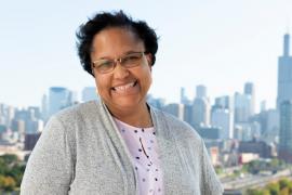 Smiling woman with Chicago skyline in background