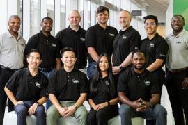 A group of students and faculty wearing shirts with Men in Nursing logos