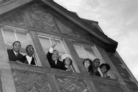 Martin Luther King Jr. waves from the window of his apartment in Chicago