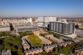 an aerial view of the RUSH campus with the south and west sides of chicago visible in the background