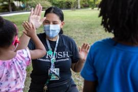 Rush social worker at a school-based health center event