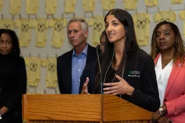 Doctor speaks to crowd