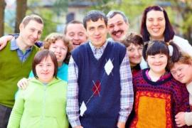 A group of people with intellectual disabilities standing together outdoors