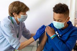 Teen getting vaccinated
