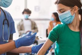 Young girl getting vaccinated