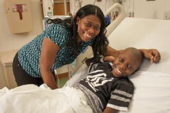 mom with son in hospital bed