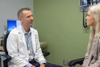 Augusto Miravalle, MD, with patient