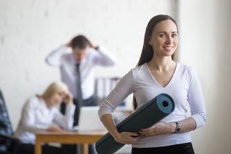 Business woman with yoga mat