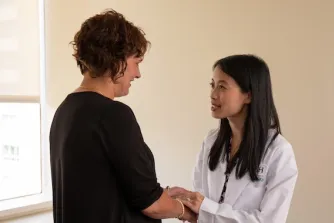 Dr. Kam with a patient