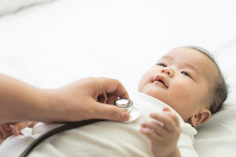 Provider exams newborn with stethoscope