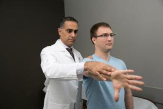 Nikhil Verma, MD, with a patient