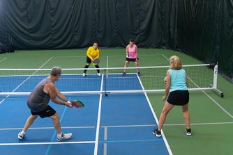Group of people playing pickleball