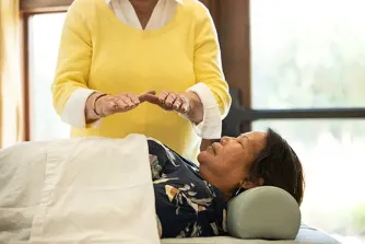 Person receiving Reiki treatment