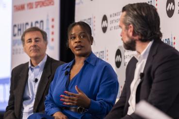 Three panelists talk during a prior year's Chicago Sports Summit.