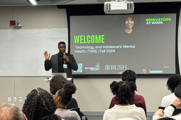 Chuka Emezue presents his research to a crowd.