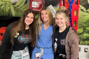 Rush Oak Park emergency medical staff (left to right) Emma Dziura, RN, Alexandra Pavalon, PCT, and Jenna Keating, RN, pose in front of a STB kit in the Emergency Department.  