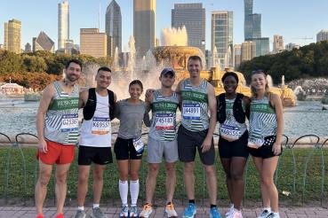 Seven members of Team Rush stand in front of Buckingham Fountain