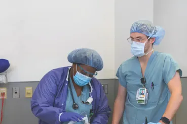 Two Rush nurses in scrubs