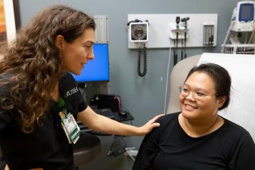 A nurse talks to a patient.
