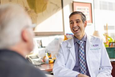Dr. David Gonzalez speaks with a patient