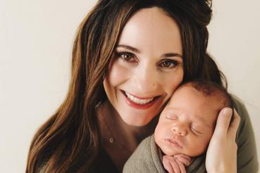 Rachel holding newborn son Graison