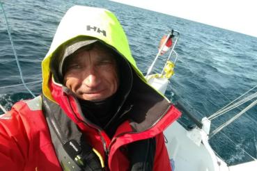 Rich Stearns sailing on open water.
