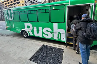 People entering a shuttle bus