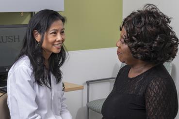 Dr Salina Lee talks with patient