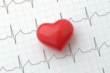 Heart symbol on top of an electrocardiogram readout