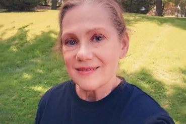 Photo of Ellen, who underwent back surgery, in her back yard