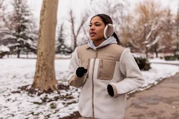Woman running in the cold