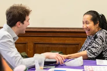 Live Health Chicago blood screening event with young man and female patient