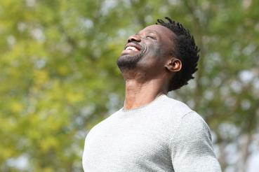 Man breathing in fresh air