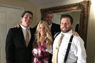 Melissa Byrne, center, with her two sons and her husband (back).