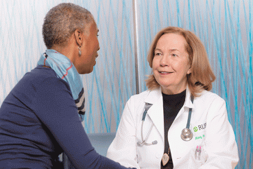 Melody Cobleigh, MD, with a patient
