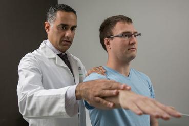 Nikhil Verma, MD, with a patient