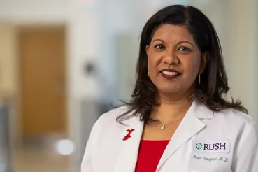 A portrait of Rupa Sanghani, MD, in a white coat.